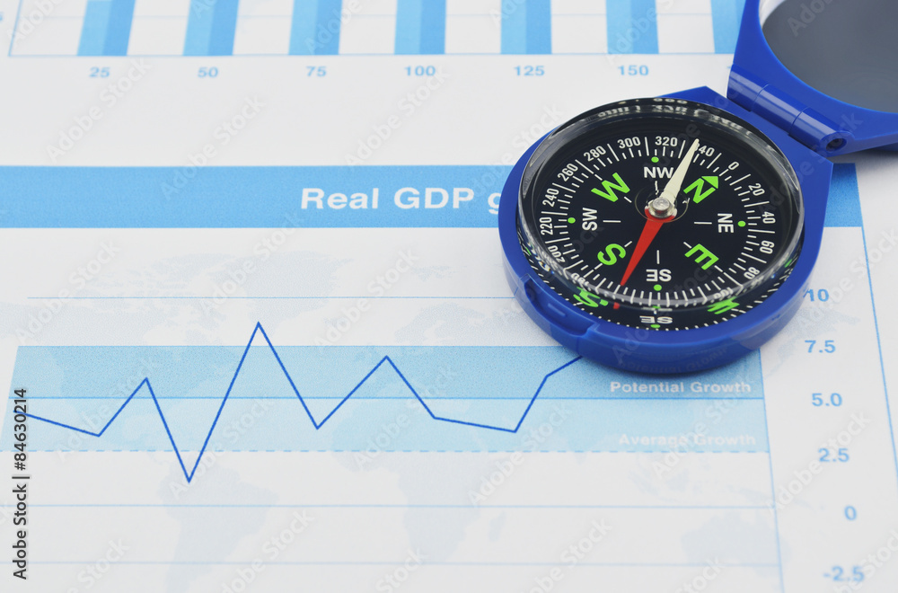 Blue compass on graph paper, Business concept Blue compass on graph paper, Business concept