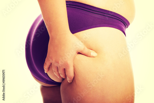 Fotografija Overweight woman checking her fat