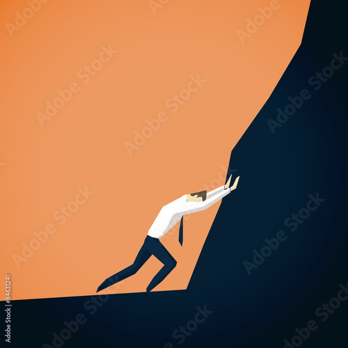 Businessman trying to move mountains