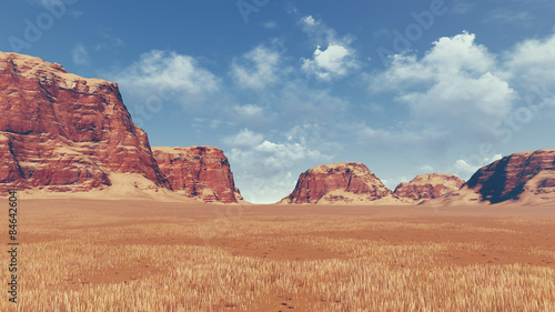 Red rocks among desert land
