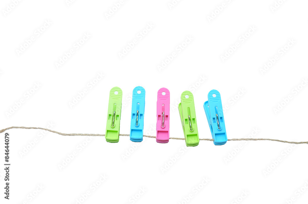 clothes-pegs isolated on a white background. Slightly defocused and close-up shot. clothes-pegs isolated on a white background. Slightly defocused and close-up shot.