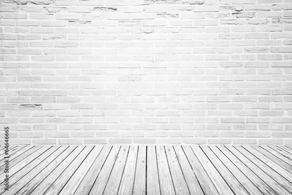 Old interior room with brick wall and wood floor Old interior room with brick wall and wood floor