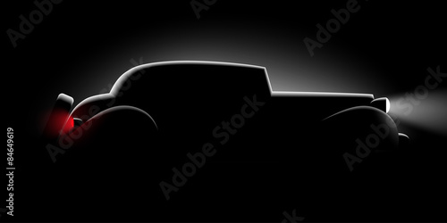 realistic retro car silhouette in the dark