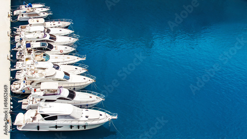Fotografie Luxury yachts dropped anchor in seaport of Monte Carlo, Monaco