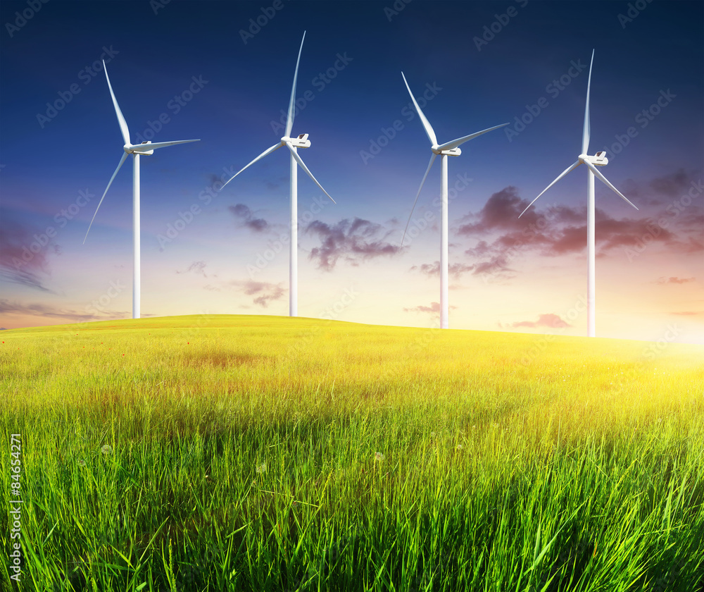 Wind power station on green field. Electrical technology