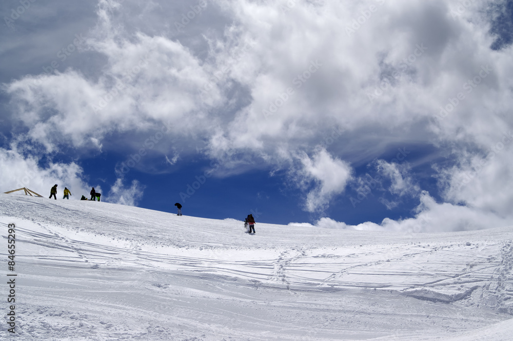 Ski slope in sun wind day