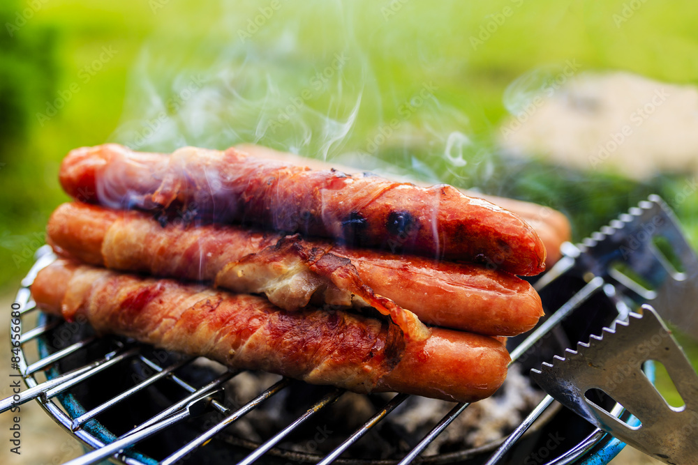 Grilled sausages with bacon