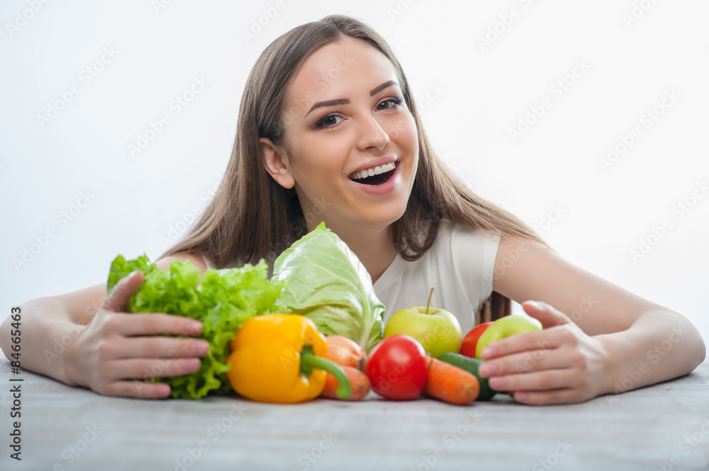 Cheerful girl is sitting with healthy food Cheerful girl is sitting with healthy food