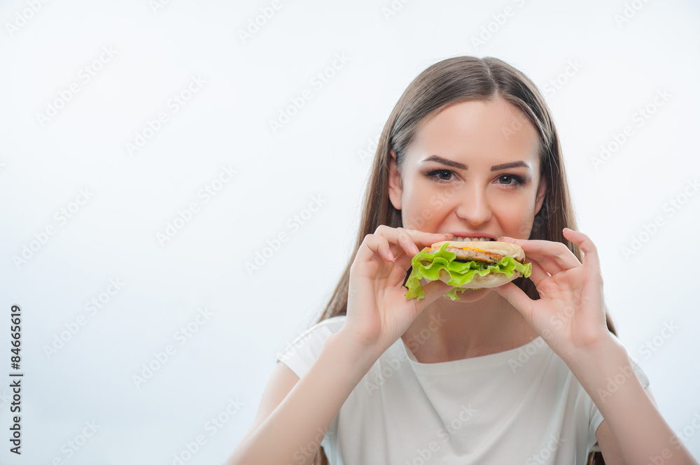 Beautiful young girl is eating unhealthy food Beautiful young girl is eating unhealthy food