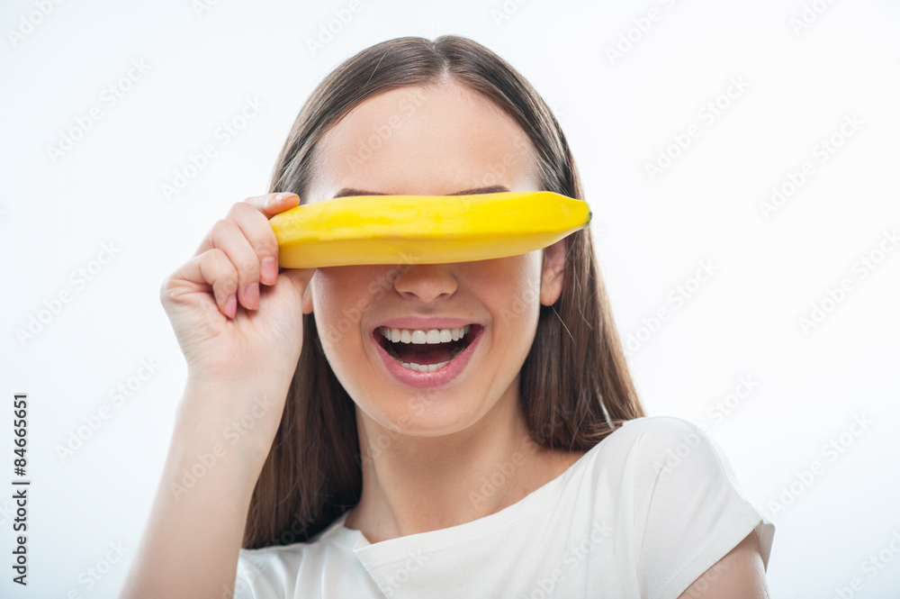 Beautiful young woman is playing with fresh fruit Beautiful young woman is playing with fresh fruit