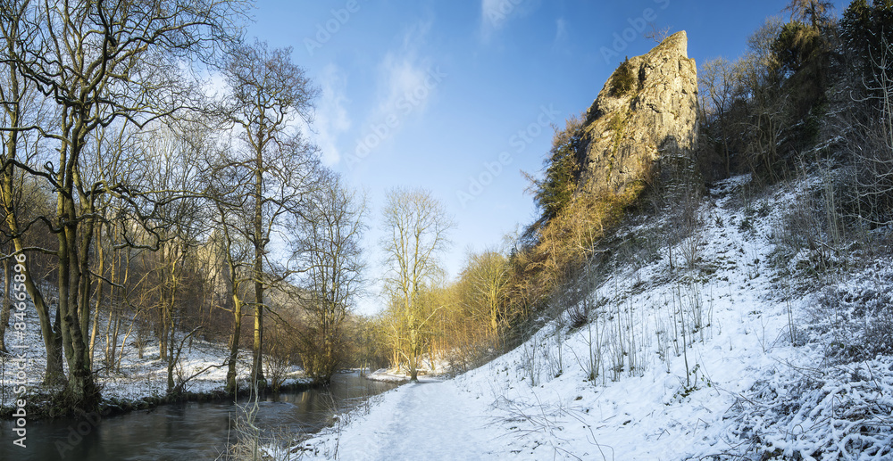 River flowing through snow covered Winter landscape in forest va River flowing through snow covered Winter landscape in forest va