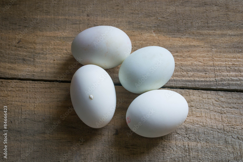 white eggs on a wooden background white eggs on a wooden background