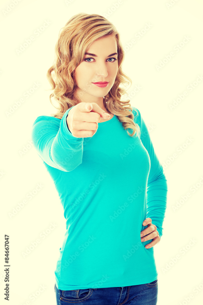 Laughing blonde woman pointing on you Laughing blonde woman pointing on you