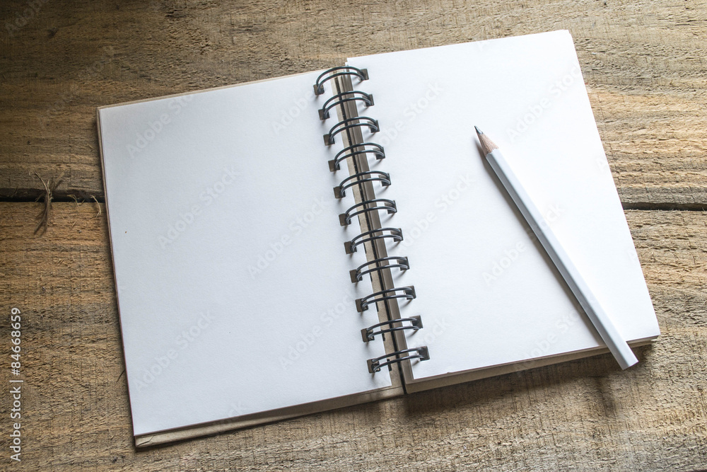 note book , pencil on old wooden note book , pencil on old wooden