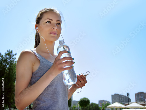 Girl is engaged in sports while listening to music