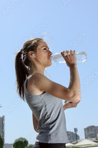 Woman is engaged in sports while listening to music.