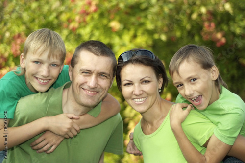 friendly family in green shirts 