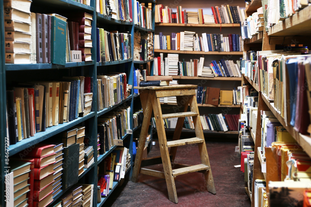Fototapeta premium Many books on bookshelf in library