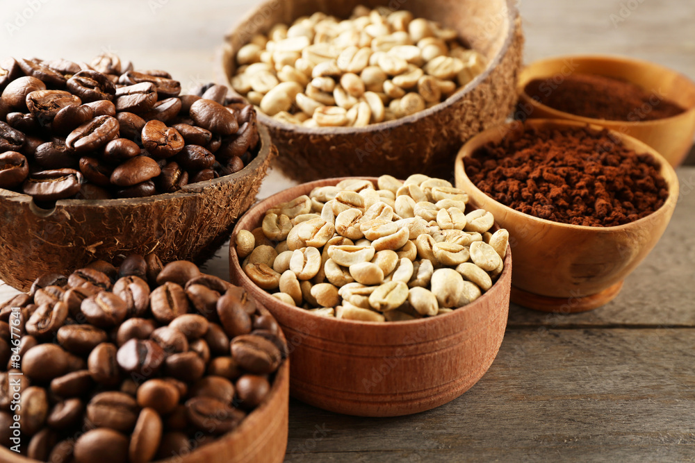 Various of coffee in small dishes on wooden table, closeup Various of coffee in small dishes on wooden table, closeup