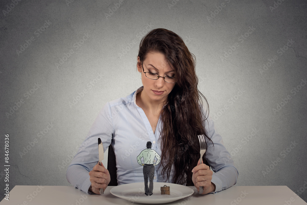 Woman sitting in front of a dish looking at a tiny man Woman sitting in front of a dish looking at a tiny man