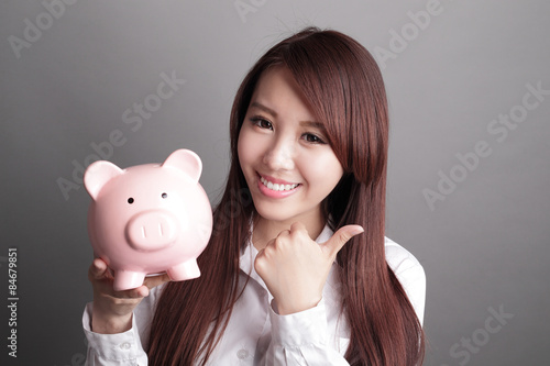 business woman with piggy bank