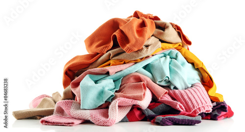 Heap of different clothes, isolated on white