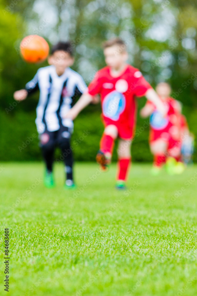 Fototapeta premium Blur of children playing soccer