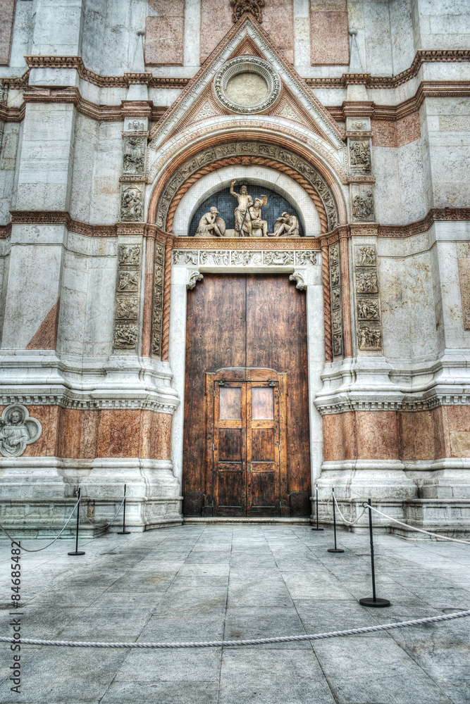 wooden door in San Petronio cathedral in Bologna