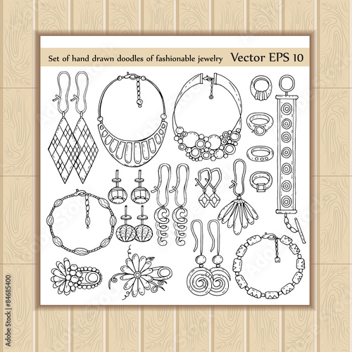 Vector set with hand drawn doodles of fashionable jewelry on white background. Sketches for use in design