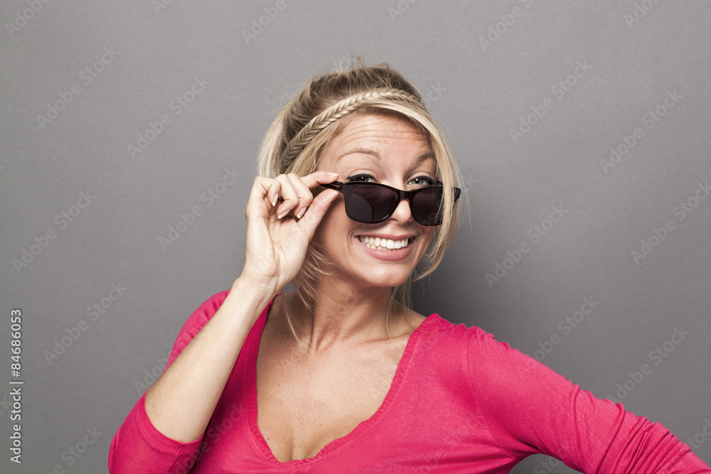 lovely blonde girl enjoying wearing smoked sunglasses lovely blonde girl enjoying wearing smoked sunglasses