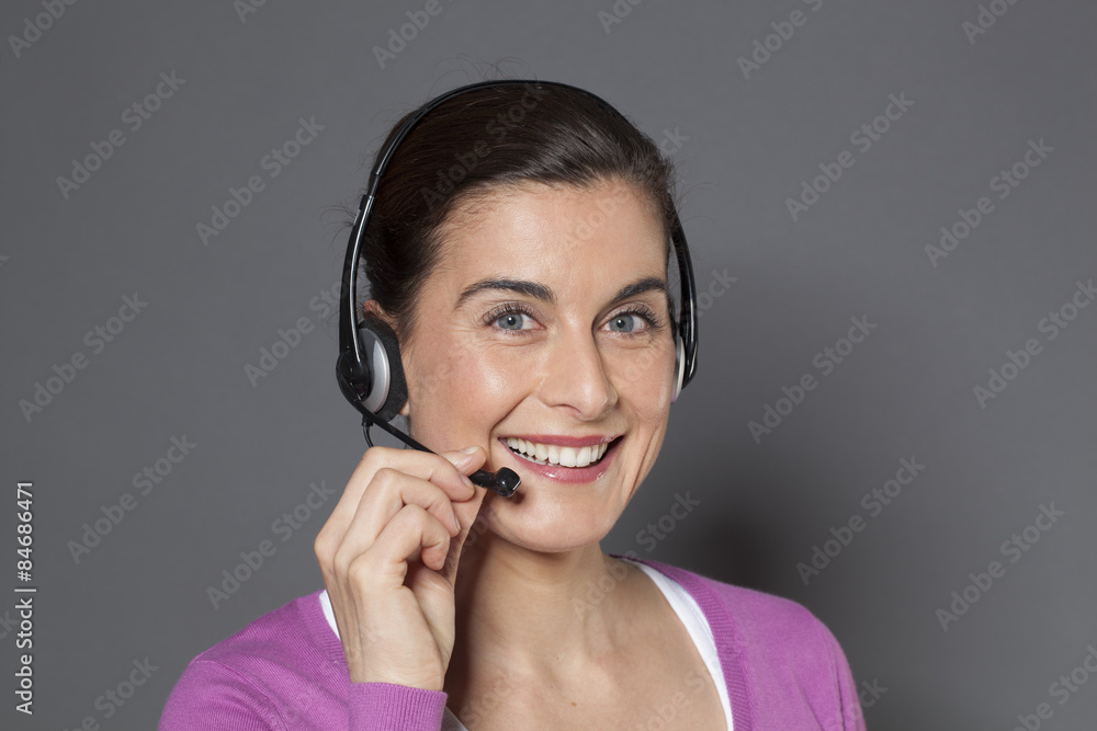 smiling female advisor answering a phone call on headset smiling female advisor answering a phone call on headset