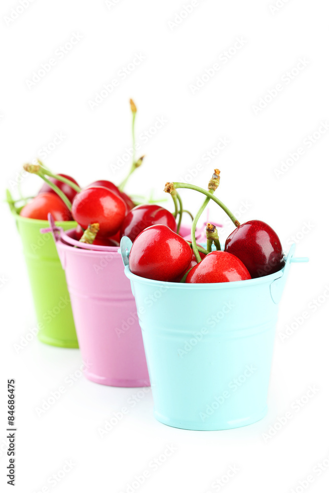 Ripe cherries in buckets isolated on white Ripe cherries in buckets isolated on white