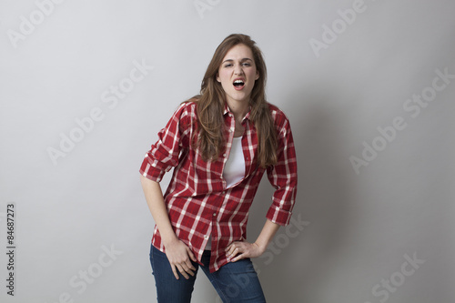 checked shirt with rolled up sleeves for unhappy young woman