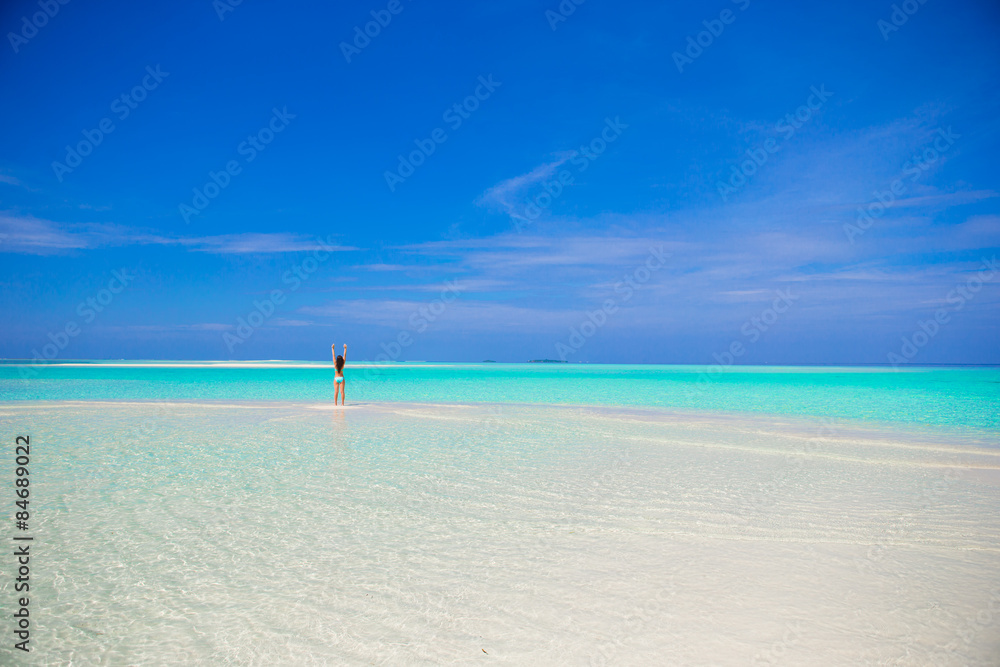 Fototapeta premium Young girl on tropical white beach 