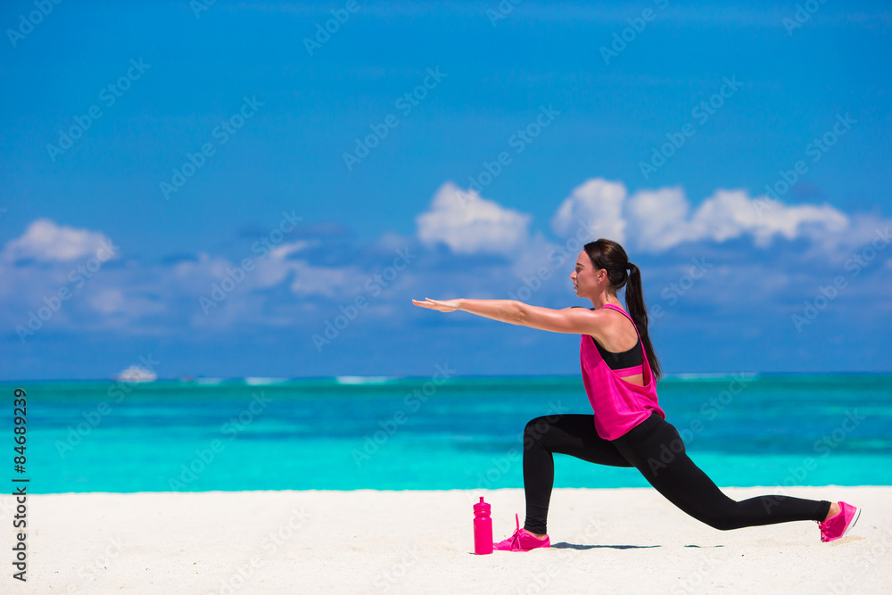 Healthy athlete woman working out doing exercise on tropical Healthy athlete woman working out doing exercise on tropical