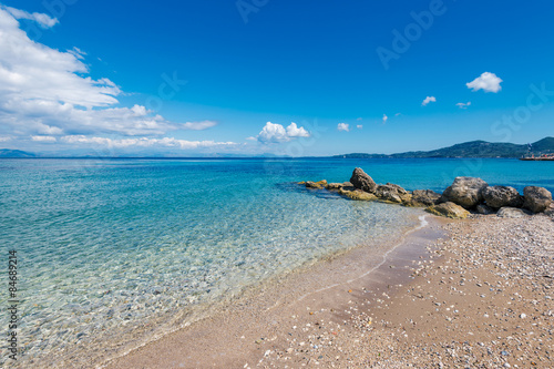  Golden sandy beach and Mediterranean sea near Agios Ioannis Peristeron. Agios Ioannis Peristeron beach at Corfu island in Greece.