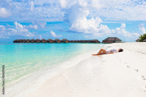 Young slim woman enjoy tropical beach vacation