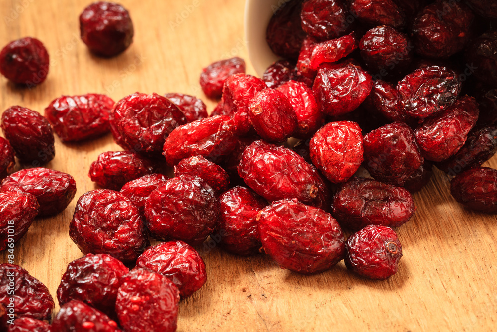 Dried cranberry fruit on wooden on table. Dried cranberry fruit on wooden on table.