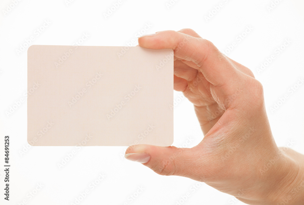 Obraz premium Female hand holding a paper card