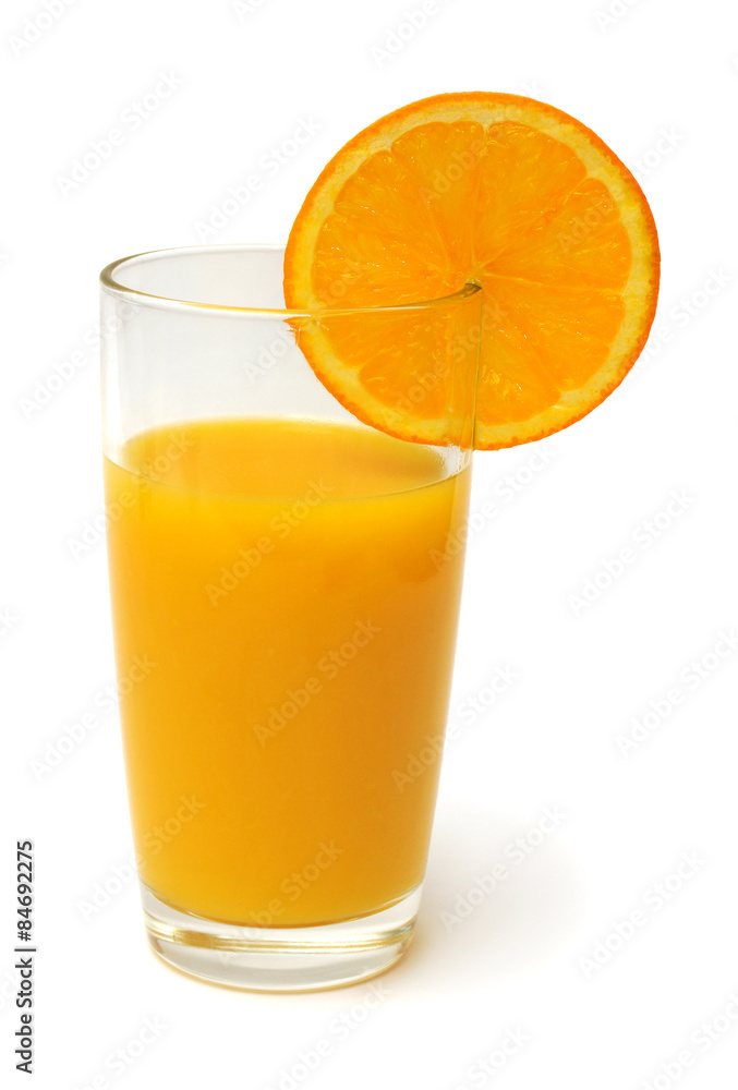 Orange juice in a glass and oranges Orange juice in a glass and oranges