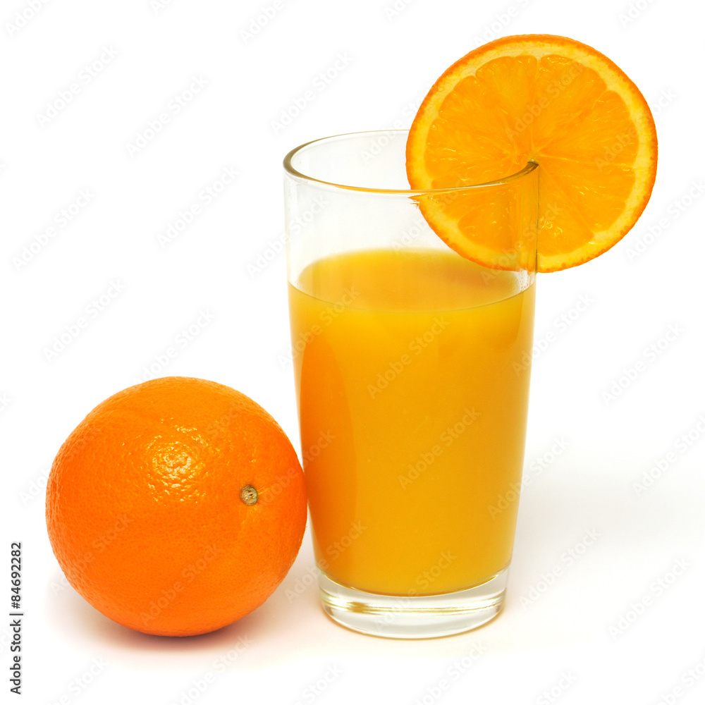 Orange juice in a glass and oranges Orange juice in a glass and oranges