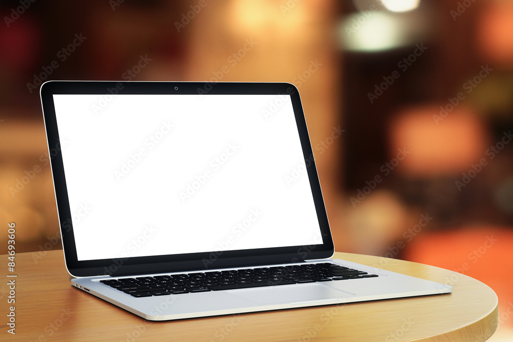 blank laptop in a cafe in the evening blank laptop in a cafe in the evening
