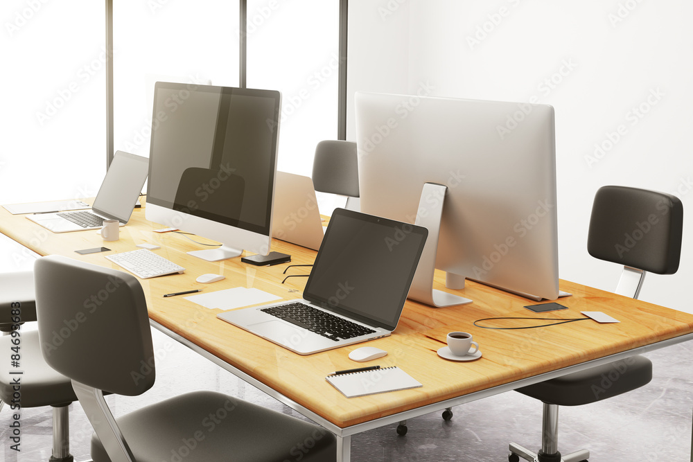 wooden conference table with office accessories and computers wooden conference table with office accessories and computers