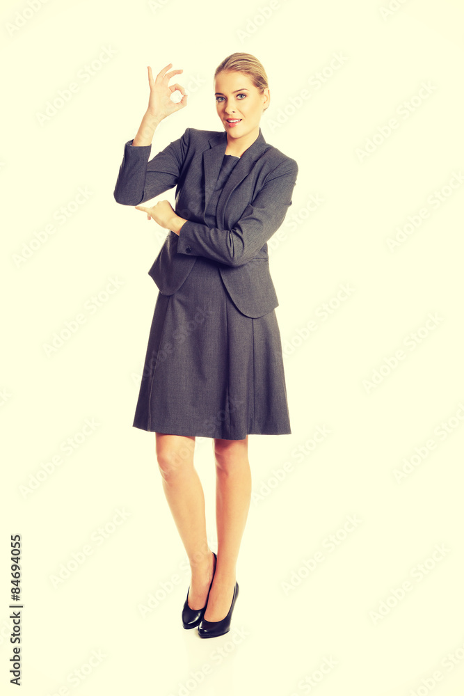 Young woman showing perfect sign Young woman showing perfect sign