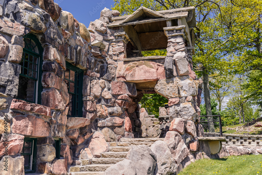 fragment of view of  big old vintage strong exterior stone house structure