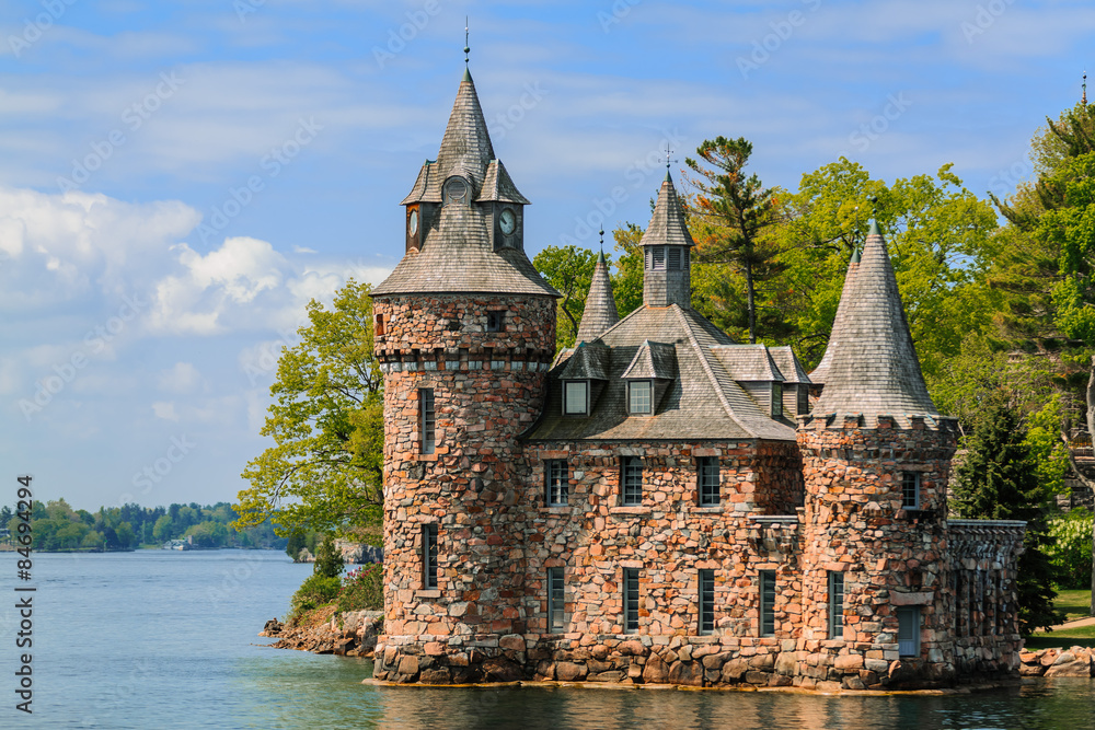  gorgeous amazing view of old vintage Boldt Castle cold house on the lake against blue sky background