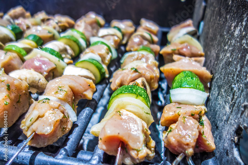 shish kebab on skewers on a grill on a holiday