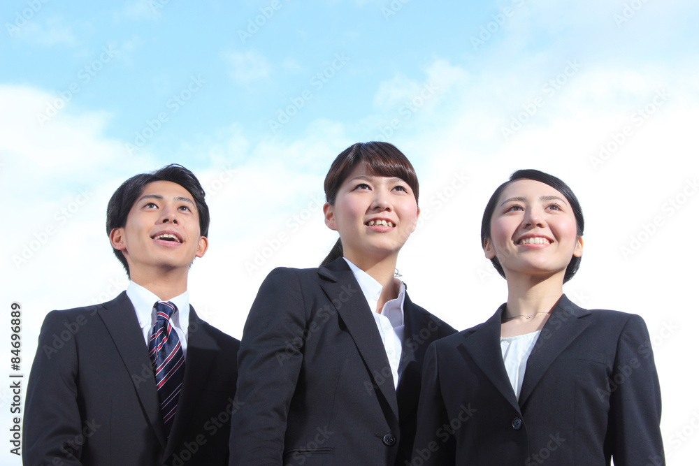 Asian businessman and businesswoman looking up at the sky Asian businessman and businesswoman looking up at the sky