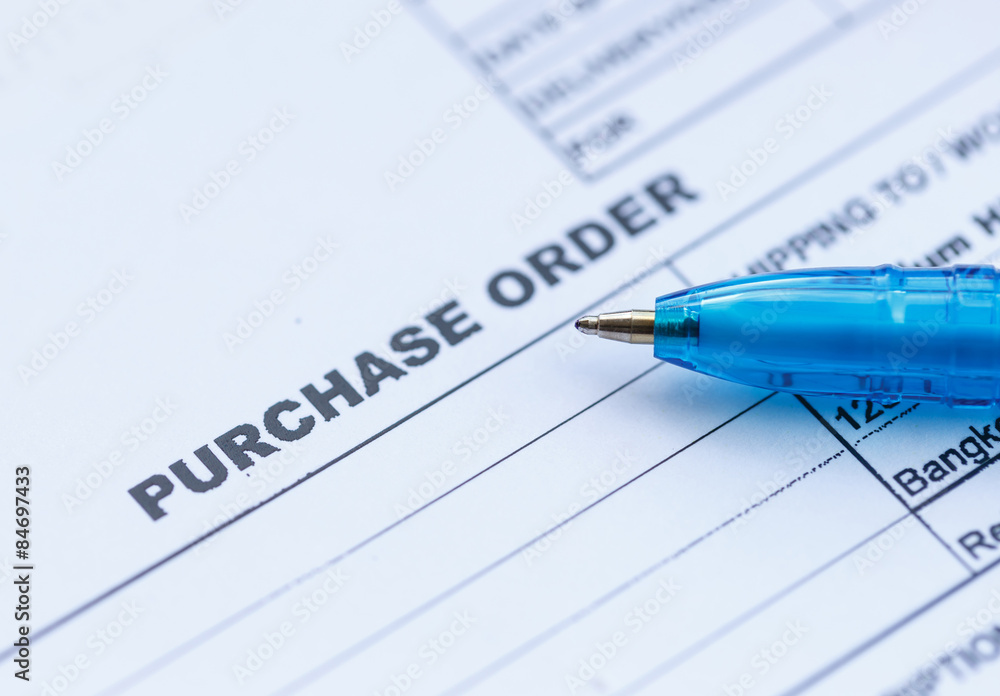 purchase order with blue pen in the office‏