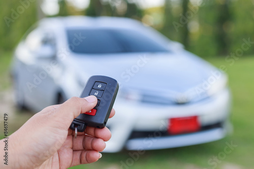 Woman hand holding key of new car